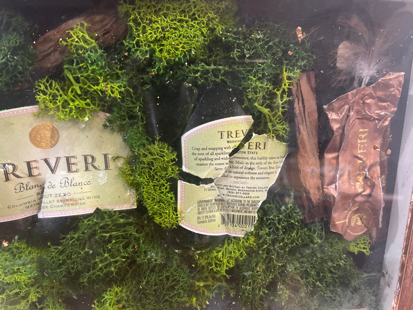 Elegant Moss-Embedded Display Case with Assorted Miniature Bottles