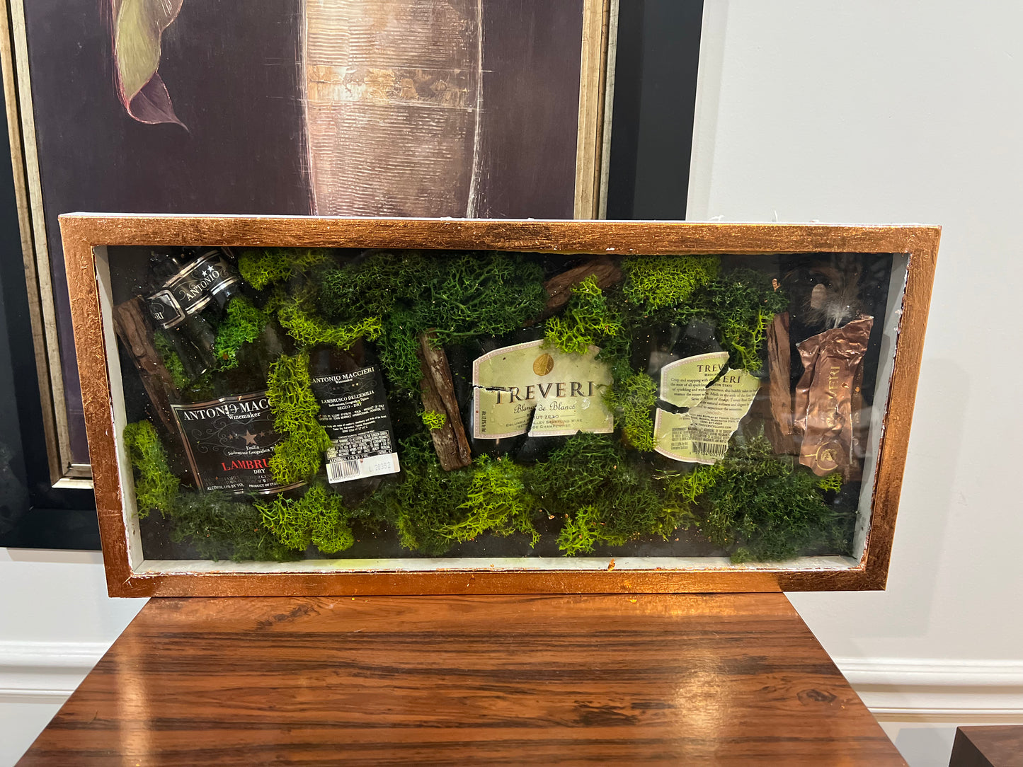 Elegant Moss-Embedded Display Case with Assorted Miniature Bottles